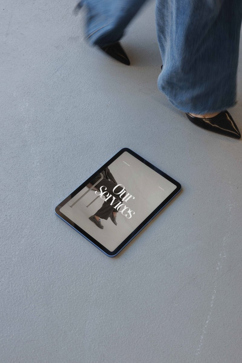 iPad Black Heels Concrete Mockup - Mock Exchange