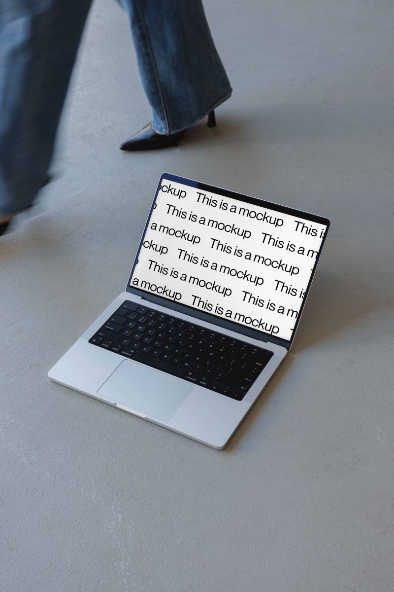 Macbook Black Heels Concrete Mockup - Mock Exchange