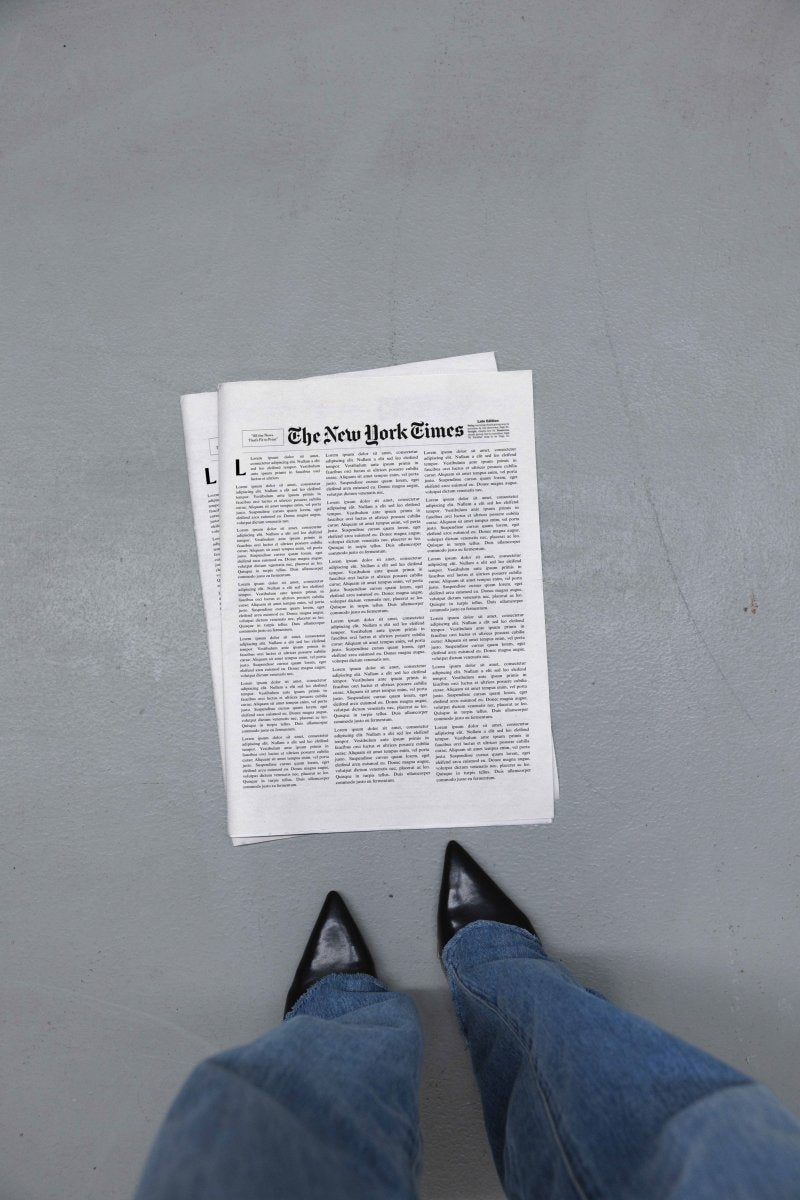 Newspaper Stacked Concrete Floor Heels Mockup - Mock Exchange