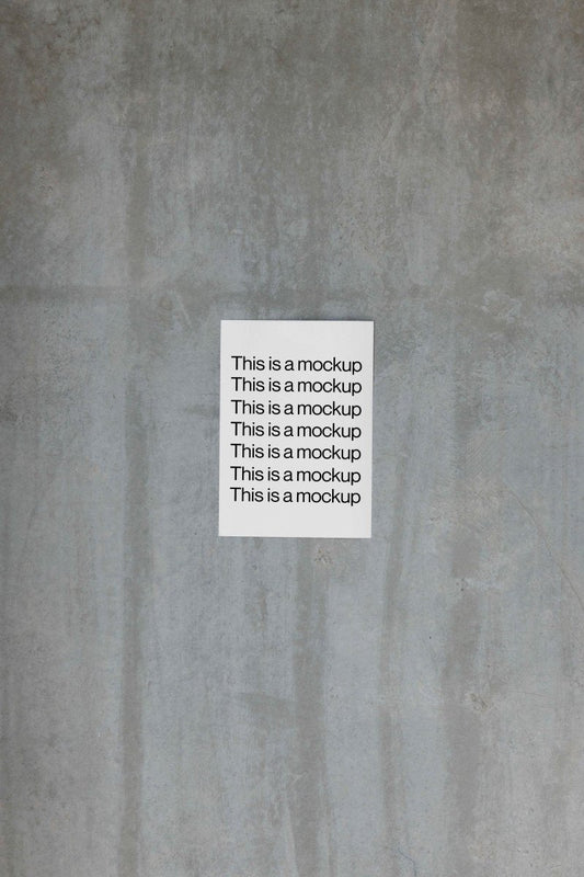 Single Paper on Concrete Wall Mockup - Mock Exchange